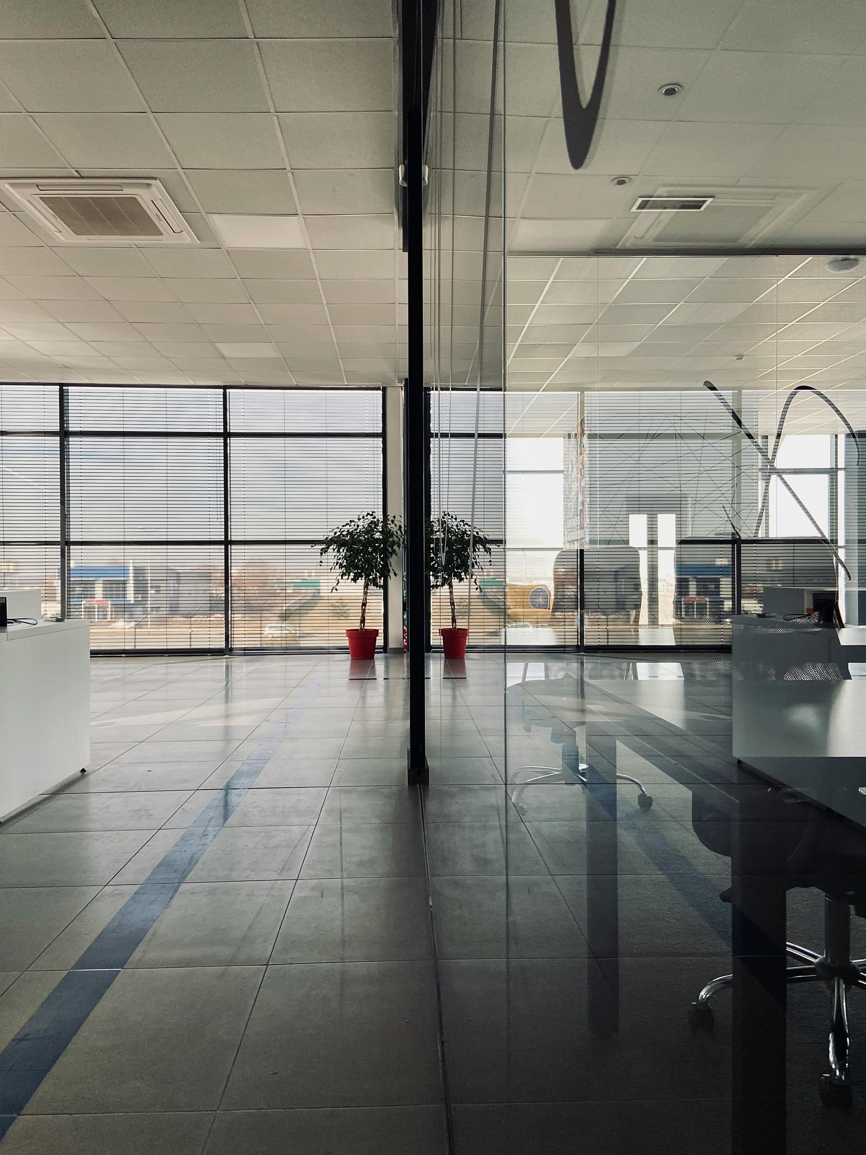 Modern commercial interior with glass office partitions